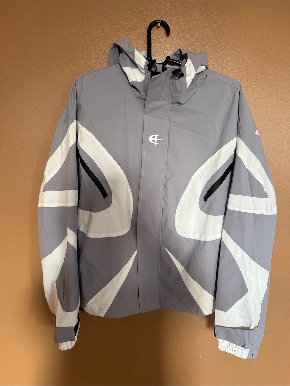 Gray and White Hooded Raincoat with Graphic Panels